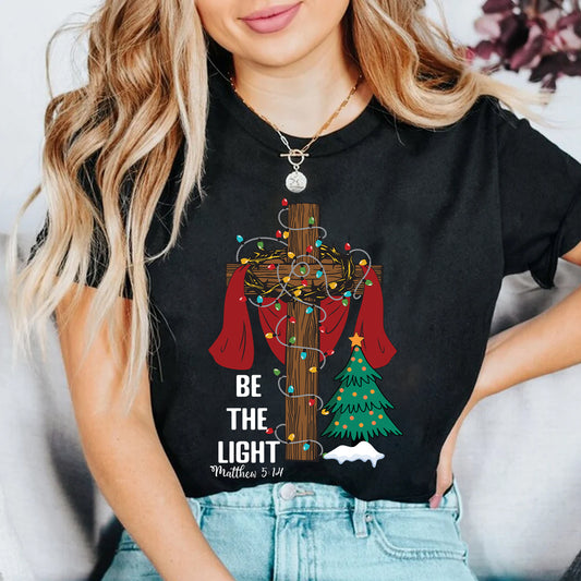 Teesdily | Be The Light Christmas Shirt, Jesus Cross Christmas Tree Sweatshirt, Christmas Family Hoodie Mug, Faith Religious Gift