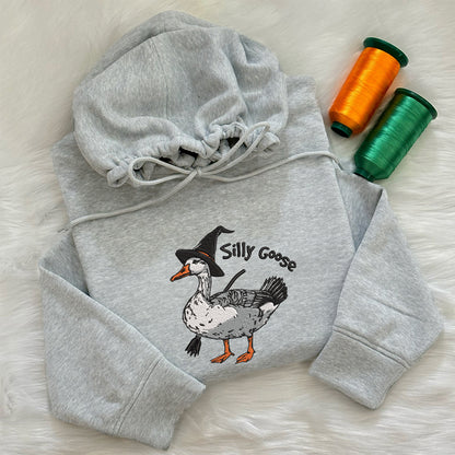 Teesdily | Halloween Goose Witch Embroidered Shirt, Silly Goose Embroidery Sweatshirt, Silly Goose On The Loose Shirt, Funny Goose Halloween Gifts