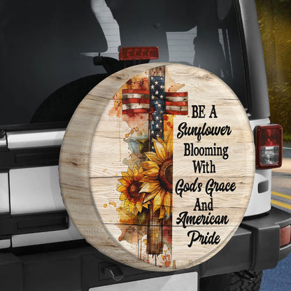 Teesdily | Jesus Cross Sunflower Spare Tire Cover, Blooming With God's Grace And American Pride, God Usa Flag Independence Spare Tire Cover 27"-34"