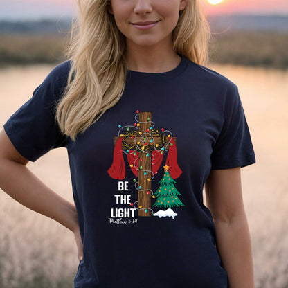 Teesdily | Be The Light Christmas Shirt, Jesus Cross Christmas Tree Sweatshirt, Christmas Family Hoodie Mug, Faith Religious Gift