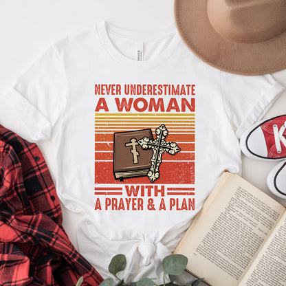 Teesdily | Jesus Christian Bible Book Retro Tshirt Never Underestimate A Woman With A Prayer And A Plan Sweatshirt Hoodie Mug Christian Gift Ideas