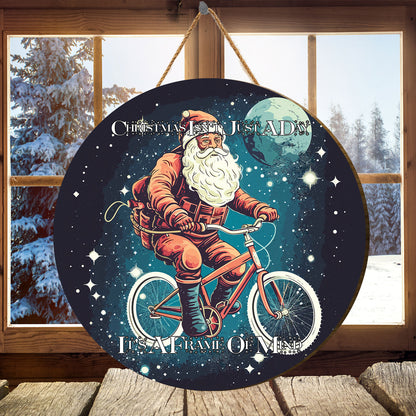 Teesdily | Customized Santa Claus Cycling Wood Sign Christmas Isn'T Just A Day It's A Frame Of Mind Front Door Sign Funny Custom Xmas Decor