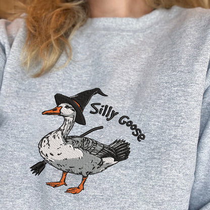 Teesdily | Halloween Goose Witch Embroidered Shirt, Silly Goose Embroidery Sweatshirt, Silly Goose On The Loose Shirt, Funny Goose Halloween Gifts