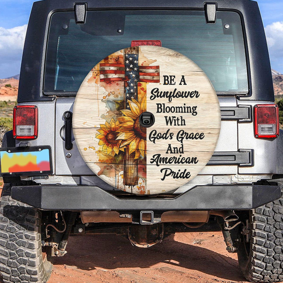 Teesdily | Jesus Cross Sunflower Spare Tire Cover, Blooming With God's Grace And American Pride, God Usa Flag Independence Spare Tire Cover 27"-34"