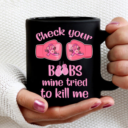 Teesdily | Check Your Boobs Mine Tries To Kill Me Shirt, Breast Cancer Sweatshirt, Cancer Awareness Pink Ribbon Hoodie Mug, Cancer Survivor Gifts