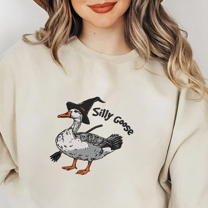 Teesdily | Halloween Goose Witch Embroidered Shirt, Silly Goose Embroidery Sweatshirt, Silly Goose On The Loose Shirt, Funny Goose Halloween Gifts